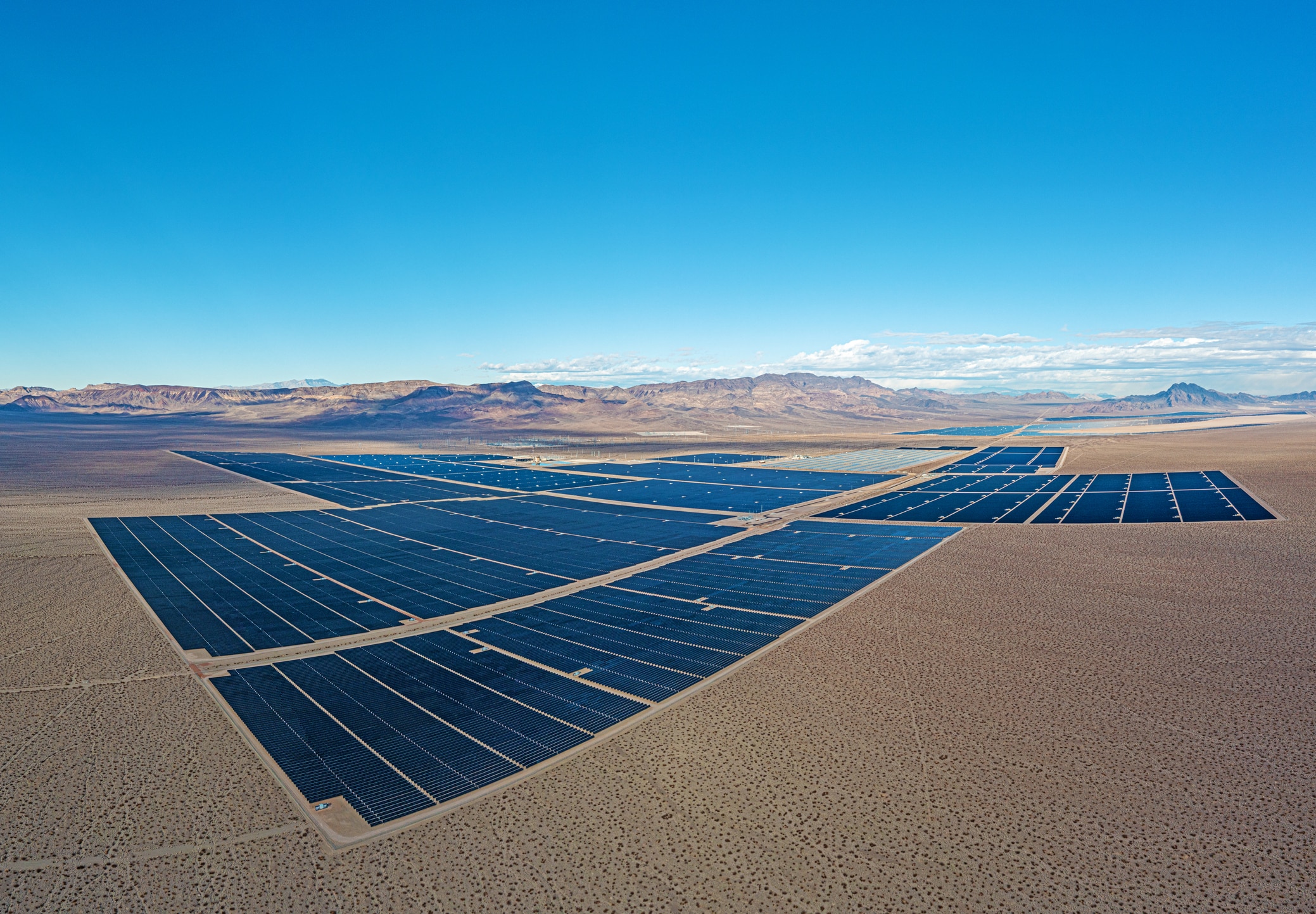 Drone panorama over a solar power plant in the Nevada desert during the day in winter sunshine